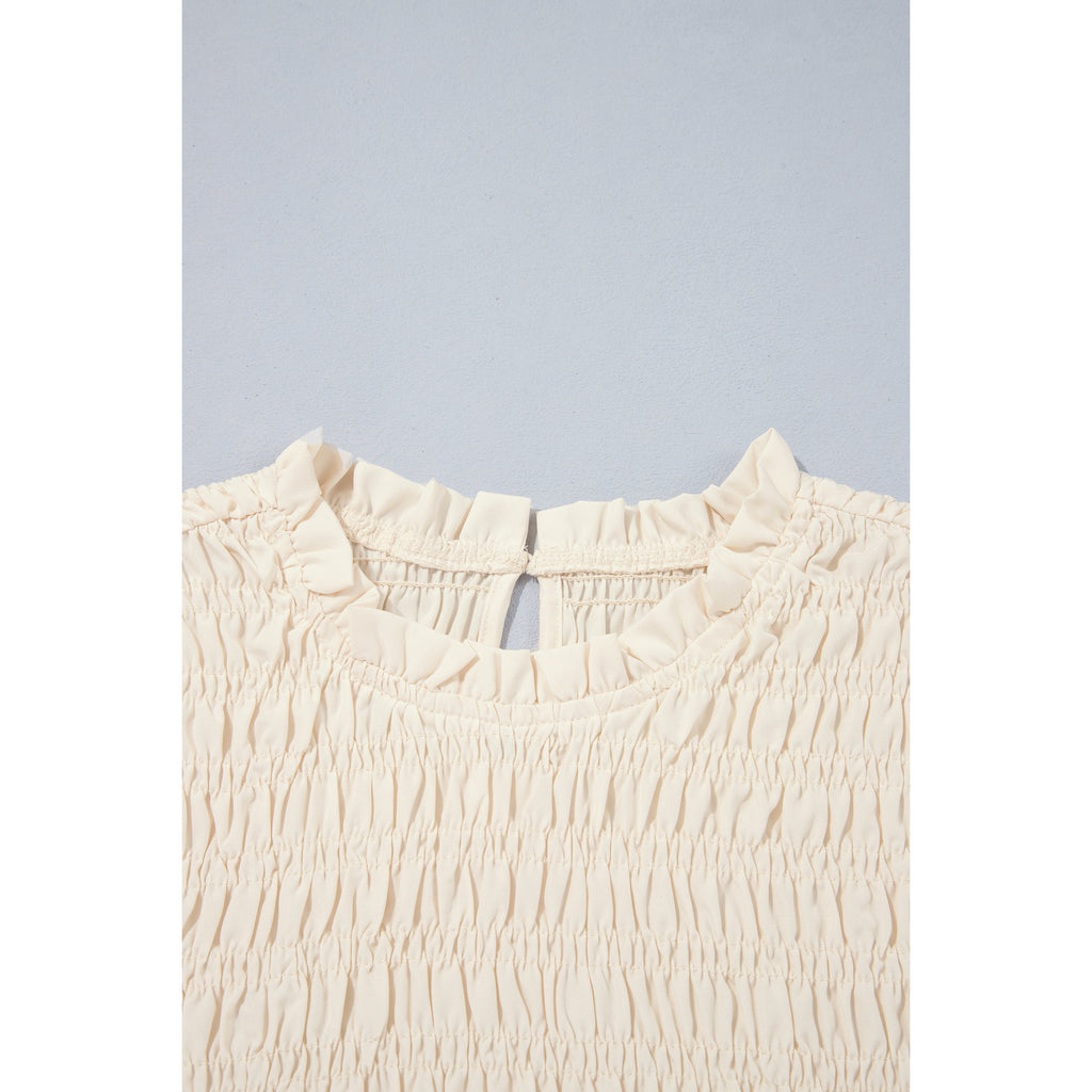 Ivory Smocked Blouse with Balloon Sleeves in Jet Stream - smocked neckline detail