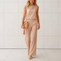 Women's wide leg jumpsuit with round neck and flowing pants front view